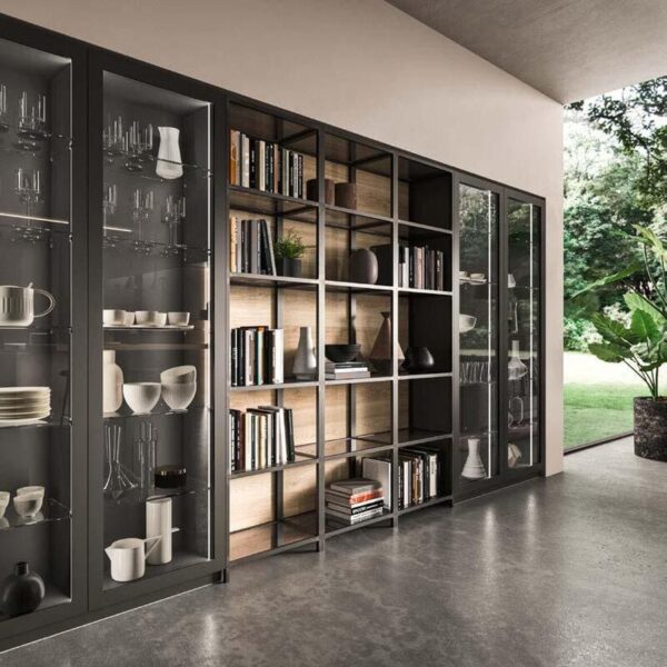 Modern shelves with books glassware